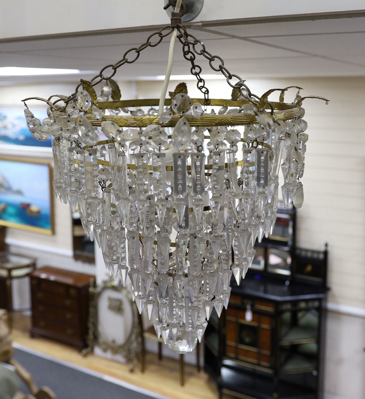 A large five tier graduated glass lustre chandelier